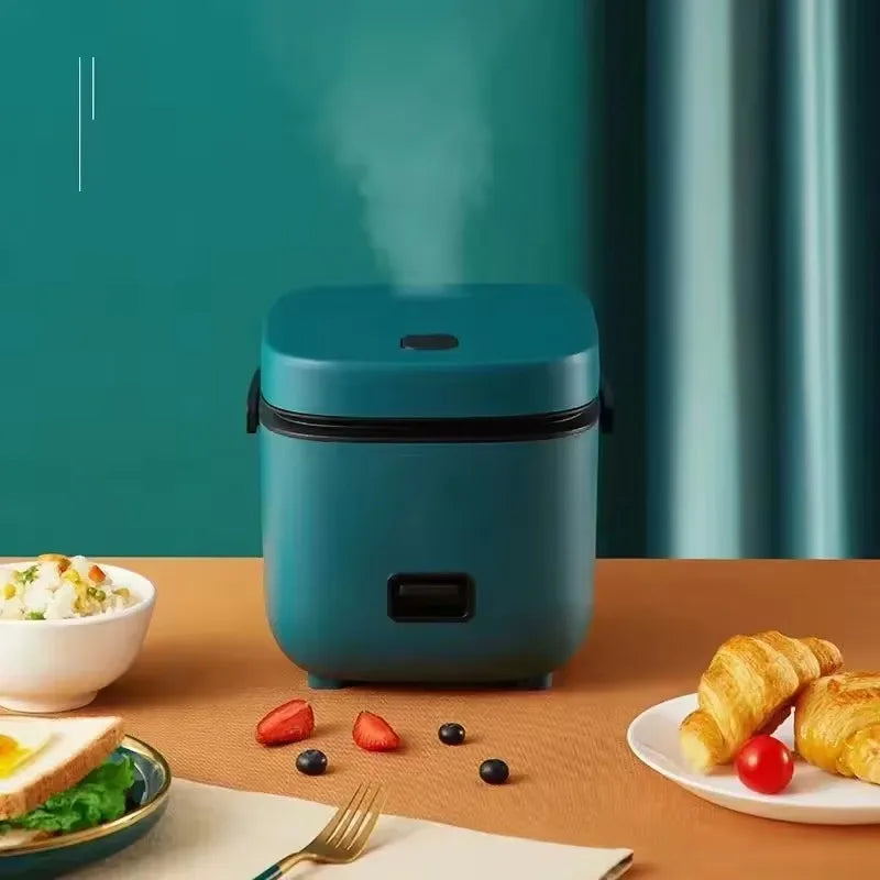 Mini cuiseur à riz vert, vapeur qui s'échappe